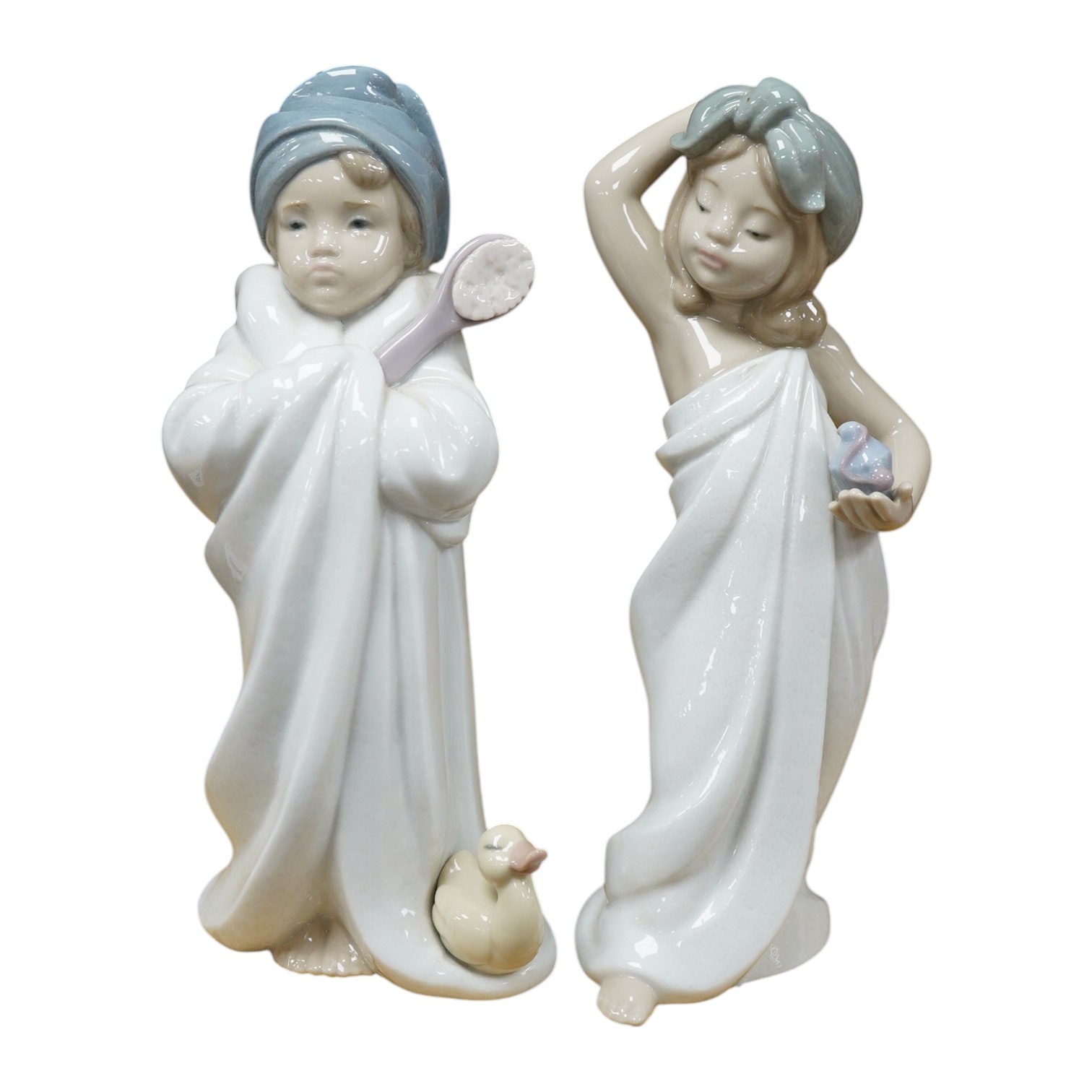 Two Lladro figures of children, 19cm high. Condition - good